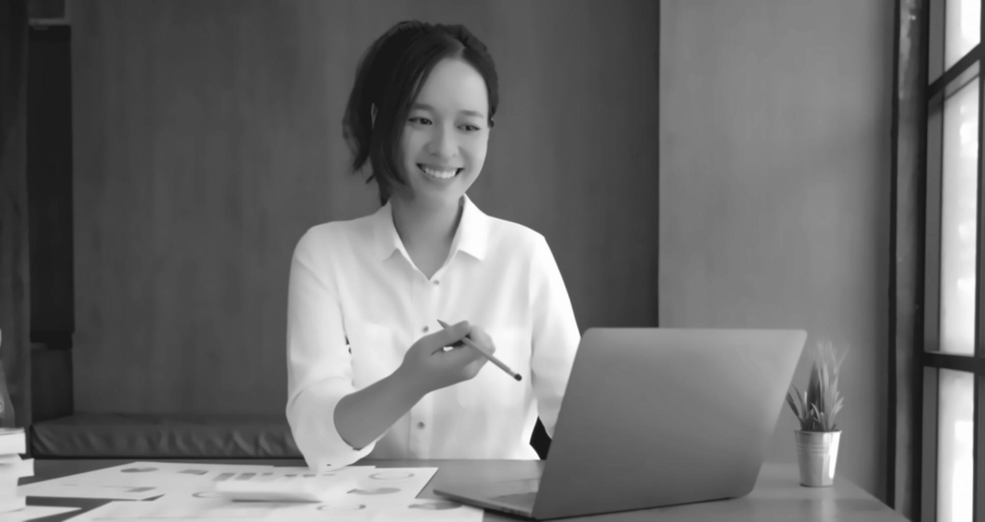 Finance professional reviewing detailed financial model on laptop screen